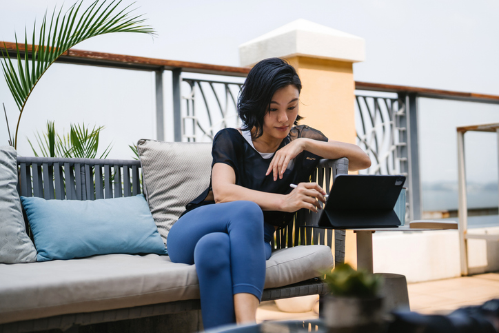 A woman researching tax rules for rebates.