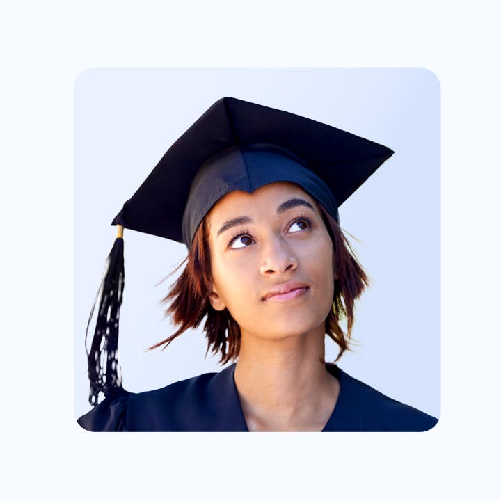 A headshot of a graduating student thinking about something